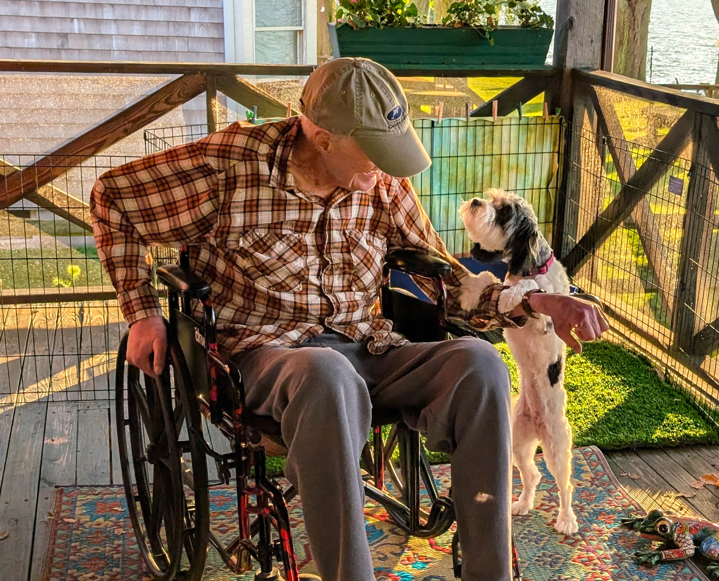 July 11. Jim on the porch with the puppy